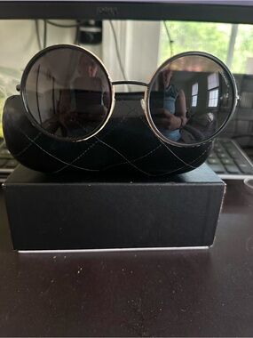 CHANEL Black round Sunglasses.